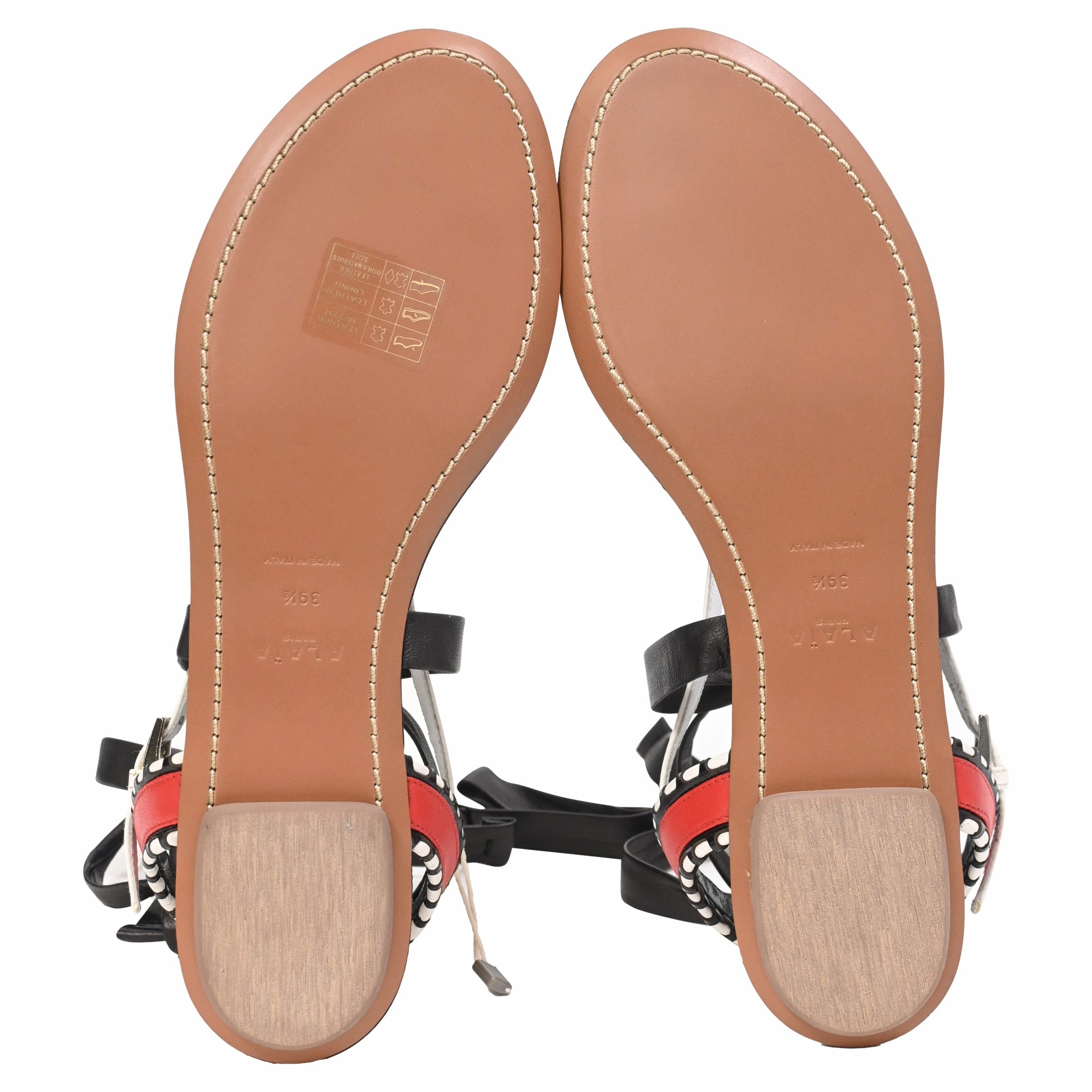 Alaa Graphic Print Gladiator Sandals in Black Leather